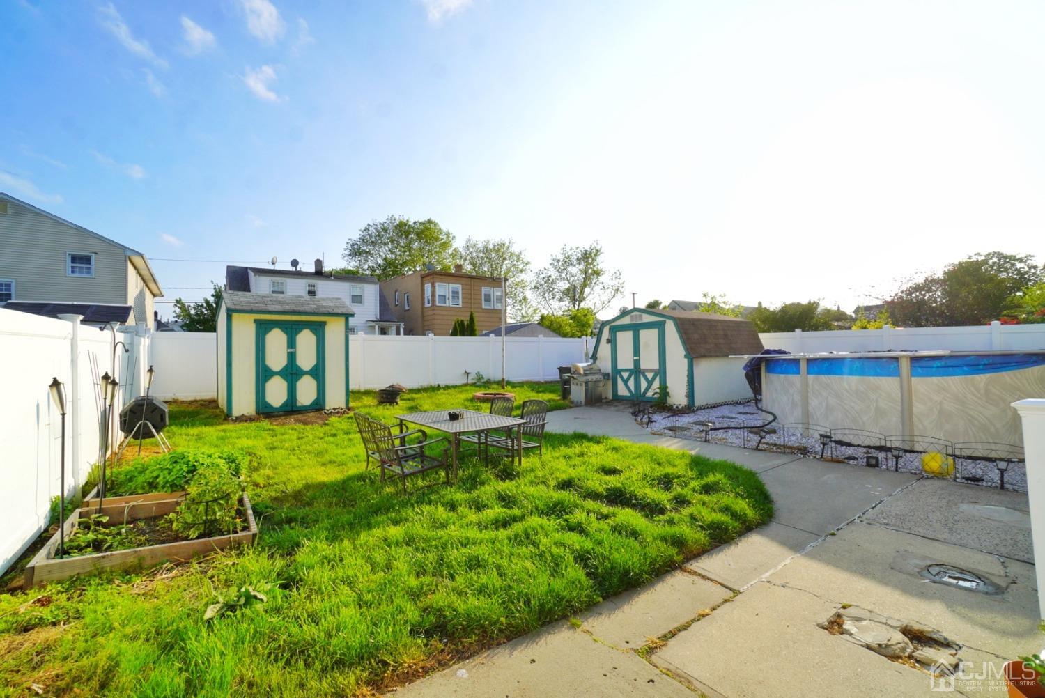 379 Summit Avenue Perth Amboy, NJ 08861 - Photo 21 of 22 a view of a house with backyard and sitting area
