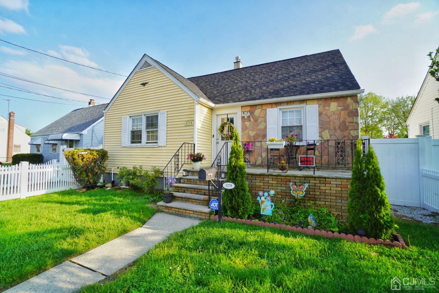 379 Summit Avenue Perth Amboy, NJ 08861 - Photo 3 of 22 a front view of a house with garden