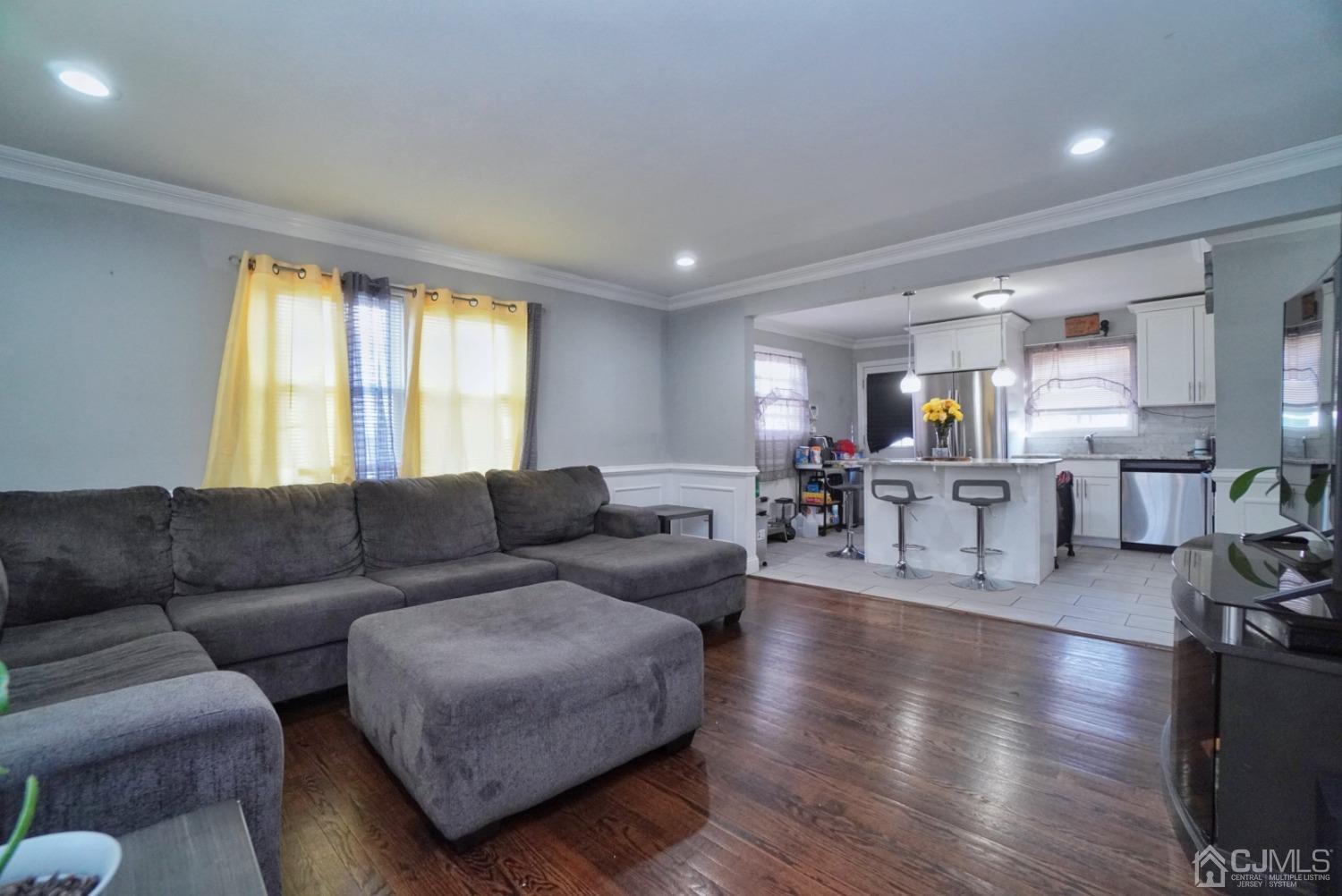 379 Summit Avenue Perth Amboy, NJ 08861 - Photo 4 of 22 a living room with furniture and a large window