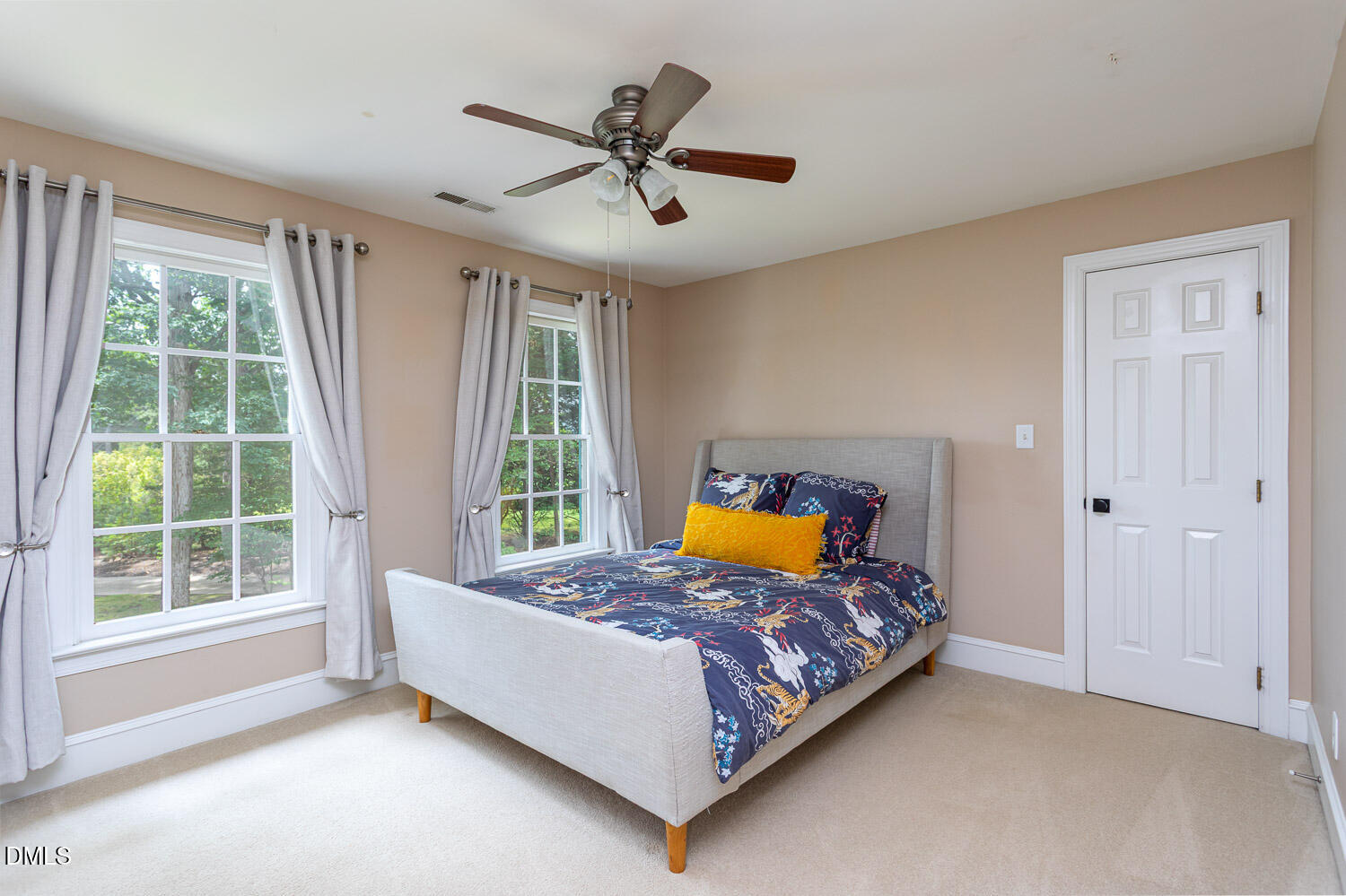 8509 Towneley Place Raleigh, NC 27615 - Photo 26 of 36 a bed sitting in a bedroom next to a window
