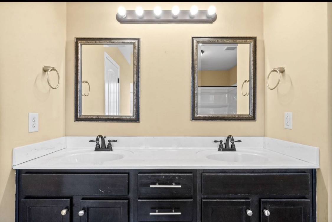 2204 Allen-Griffey Road Clarksville, TN 37042 - Photo 6 of 11 a bathroom with a sink and a mirror