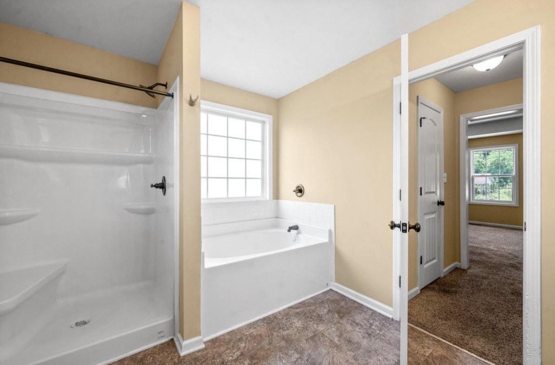2204 Allen-Griffey Road Clarksville, TN 37042 - Photo 8 of 11 a bathroom with a bathtub and a shower