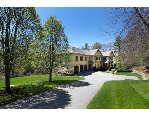 91 Fairview Road Weston, MA 02493 - Photo 1 of 23 a front view of a house with a yard and trees