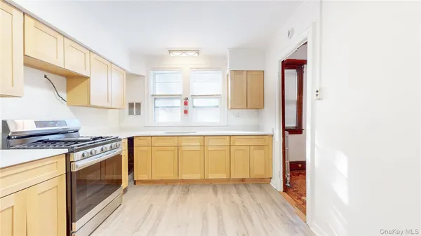 a kitchen with stainless steel appliances granite countertop a stove and a sink