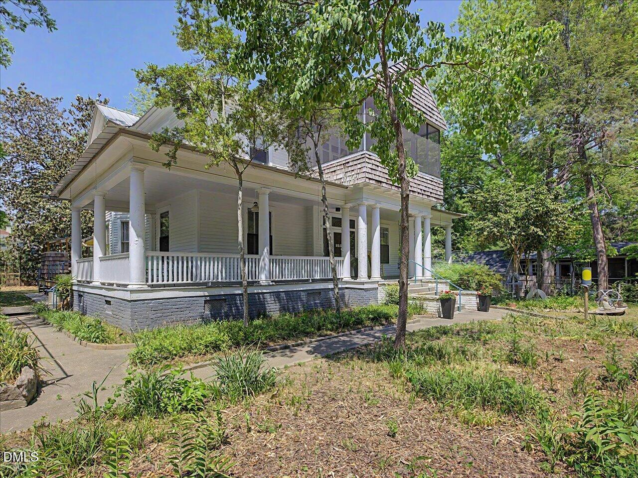 215 Hillcrest Road Raleigh, NC 27605 - Photo 5 of 97 a view of a house with a yard and sitting area