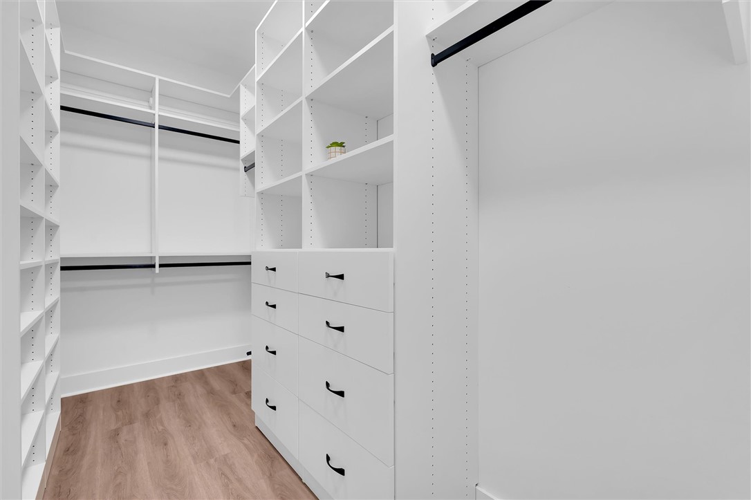 407 Blue Ridge Court Westminster, SC 29693 - Photo 27 of 48 This spacious closet features ample shelving and drawer storage for optimal organization.