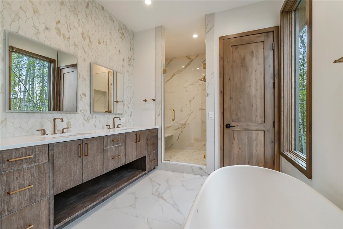1615 Golden Eagle Road Silverthorne, CO 80498 - Photo 26 of 47 a spacious bathroom with a double vanity sink mirror and double