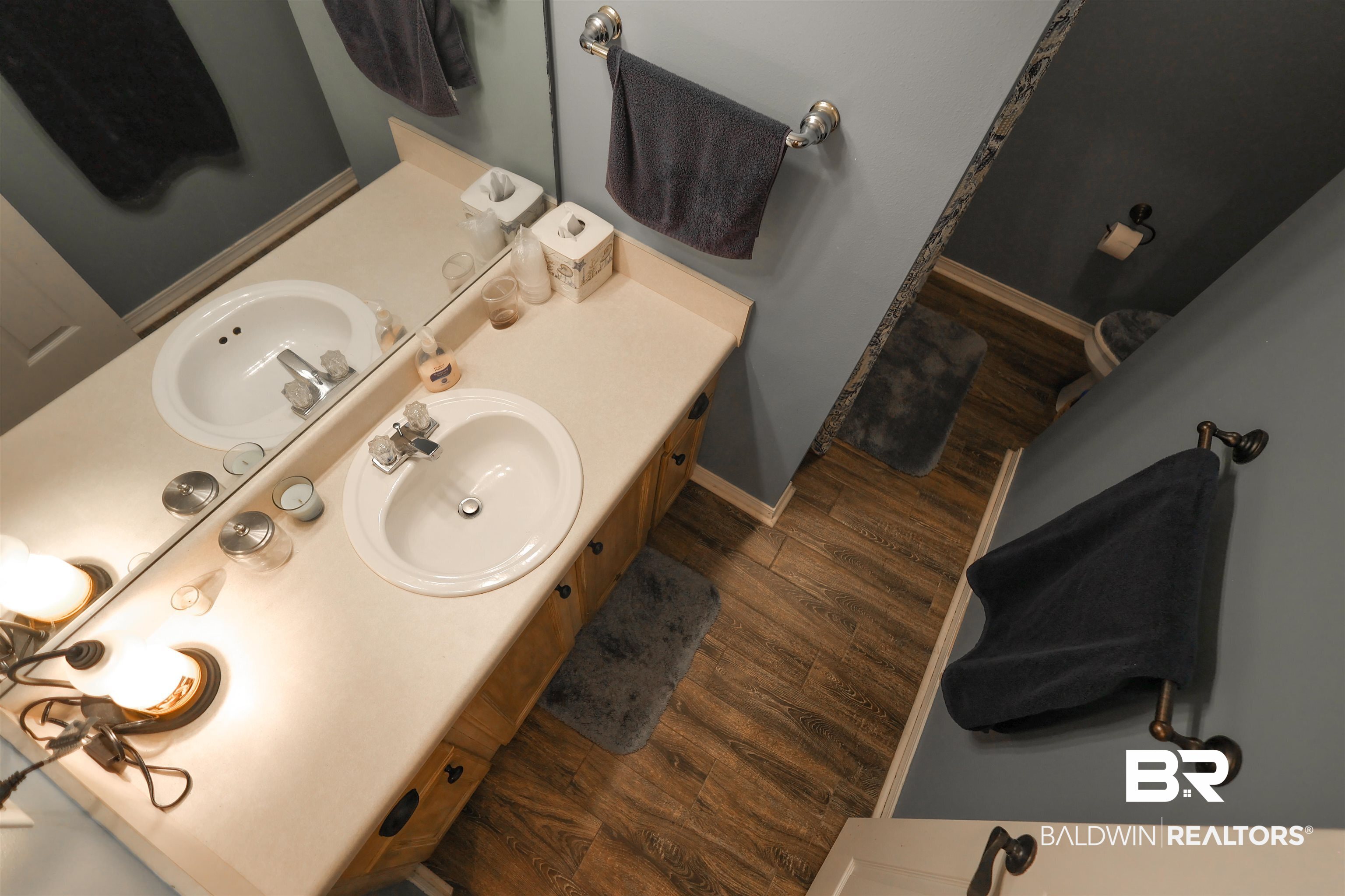 7790 Audubon Drive Foley, AL 36535 - Photo 30 of 39 Double vanity featuring individual oval sinks with chrome faucets, set in a light-toned countertop