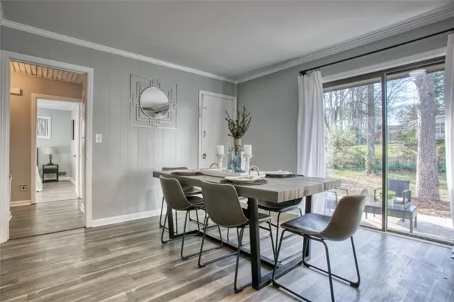 a view of a dining room with furniture and wooden floor