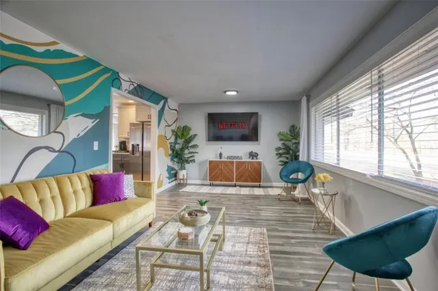 a living room with furniture and a large window