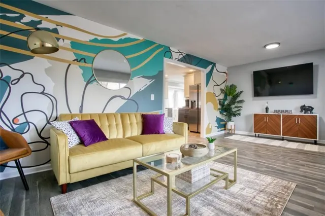 a living room with furniture and a flat screen tv