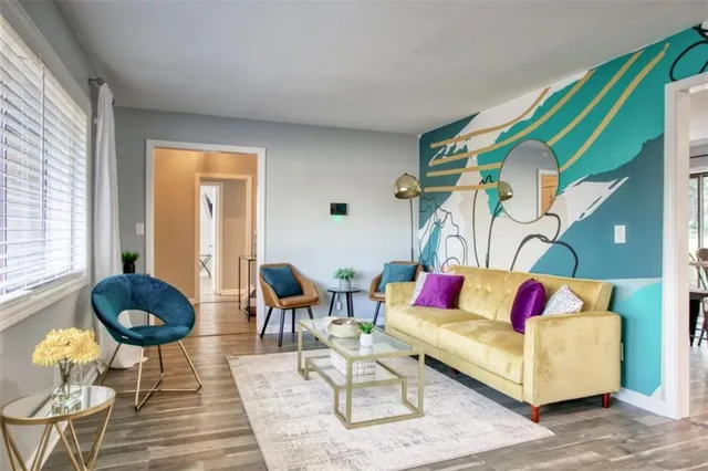 a living room with furniture and a rug