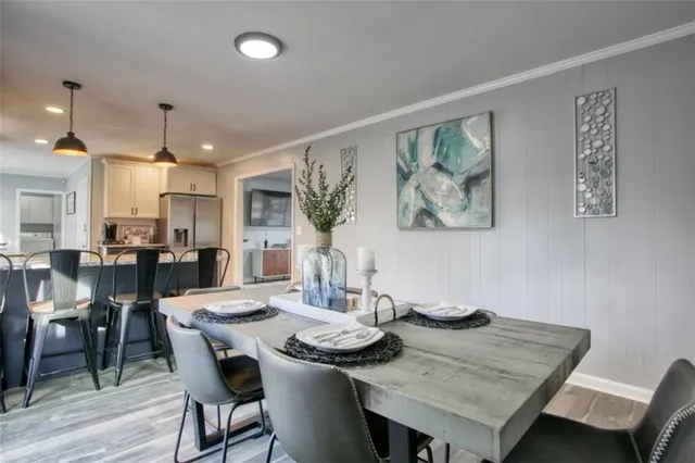 a view of a dining room with furniture and wooden floor