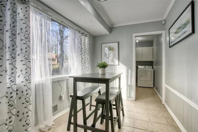 a view of a dining room with furniture and window
