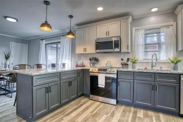 a kitchen with lots of counter space sink and appliances