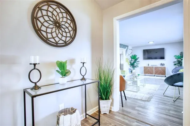 a living room with furniture and a potted plant