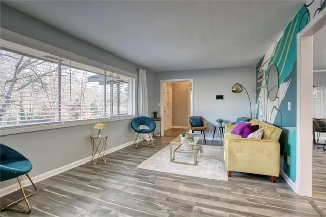 a living room with furniture and a large window