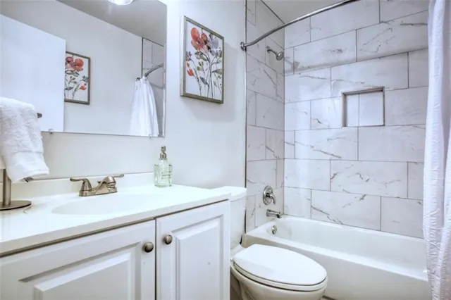 a bathroom with a sink a toilet and a bathtub