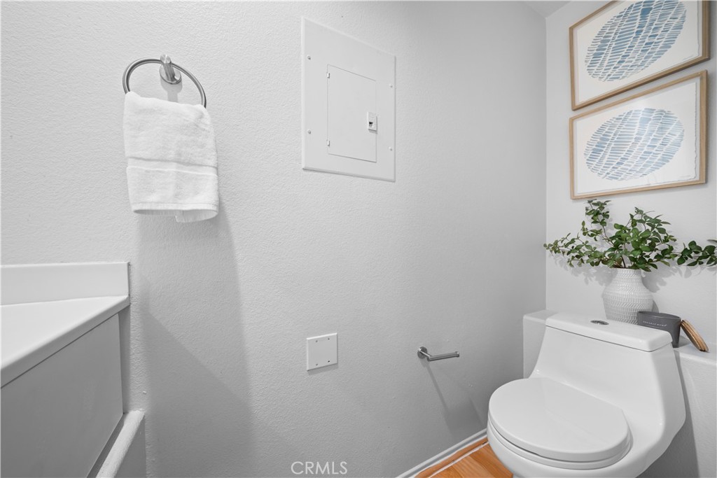 6 Arese Aisle Irvine, CA 92606 - Photo 14 of 38 a white toilet sitting next to a bathroom sink