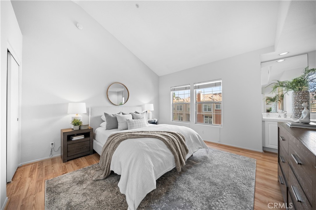 6 Arese Aisle Irvine, CA 92606 - Photo 17 of 38 a bed room with a bed mirror and a window