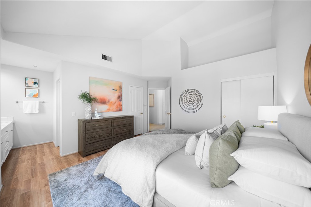 6 Arese Aisle Irvine, CA 92606 - Photo 19 of 38 a bedroom with a bed and a closet