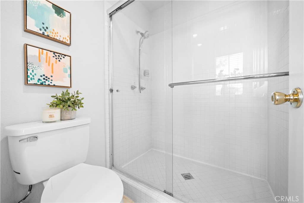 6 Arese Aisle Irvine, CA 92606 - Photo 21 of 38 a white toilet sitting next to a bath tub shower