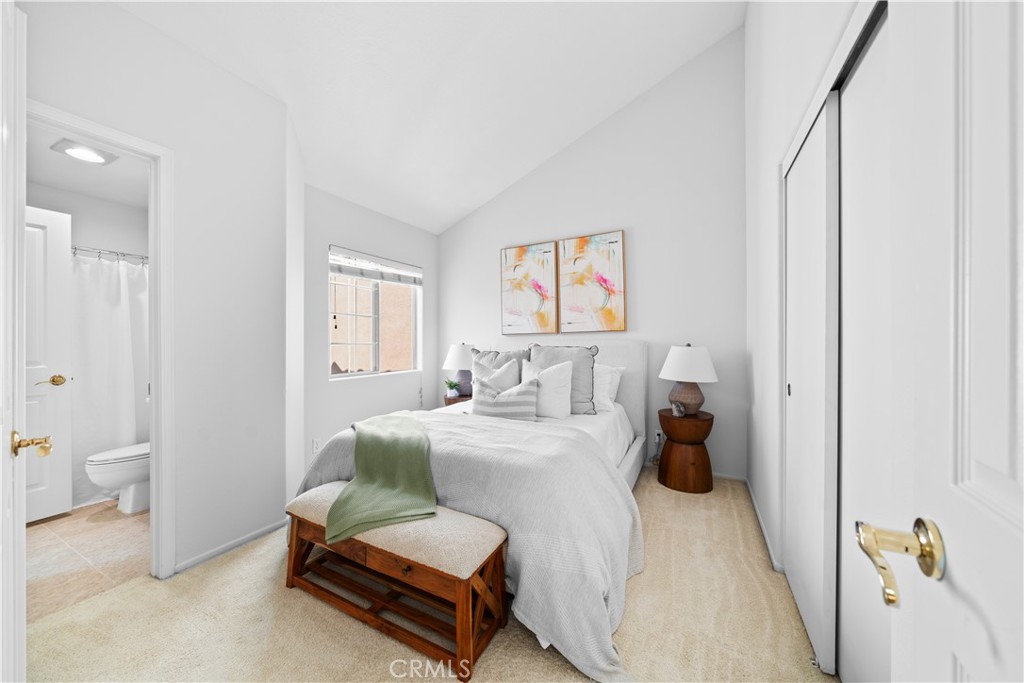 6 Arese Aisle Irvine, CA 92606 - Photo 24 of 38 a bedroom with a bed and a couch