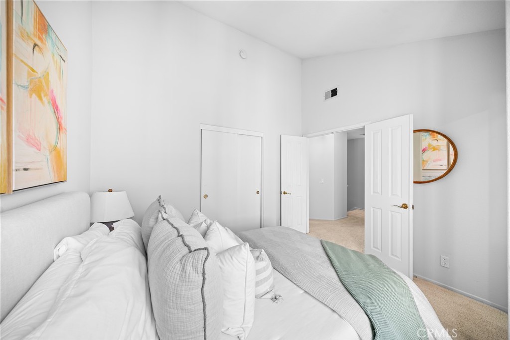 6 Arese Aisle Irvine, CA 92606 - Photo 25 of 38 a bedroom with a bed and a window