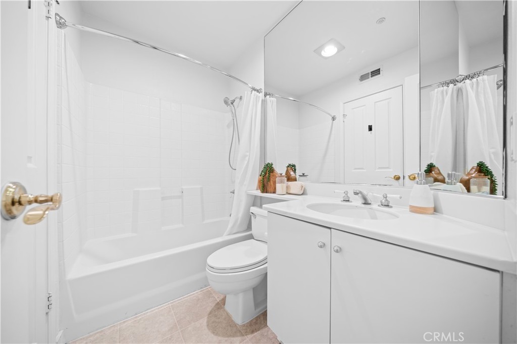 6 Arese Aisle Irvine, CA 92606 - Photo 26 of 38 a bathroom with a sink a toilet and shower