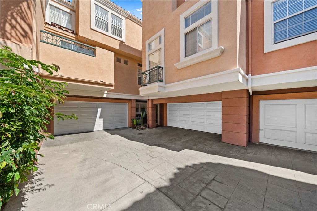 6 Arese Aisle Irvine, CA 92606 - Photo 31 of 38 a front view of a building with a garage