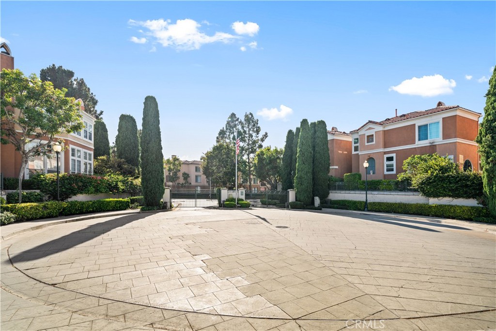 6 Arese Aisle Irvine, CA 92606 - Photo 34 of 38 a row of palm trees and building in the background
