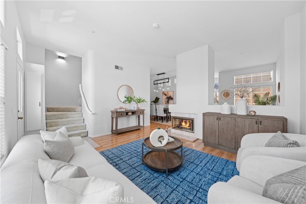 6 Arese Aisle Irvine, CA 92606 - Photo 4 of 38 a living room with furniture and a wooden floor