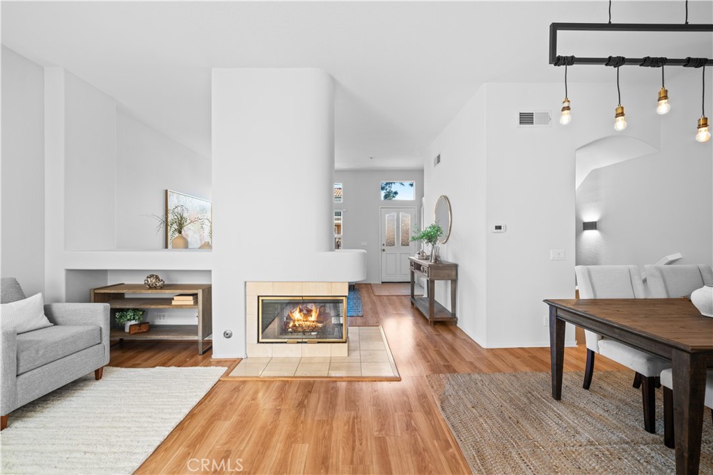 6 Arese Aisle Irvine, CA 92606 - Photo 7 of 38 a living room with furniture and a fireplace