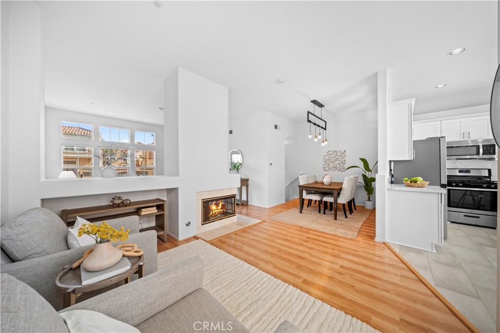 6 Arese Aisle Irvine, CA 92606 - Photo 8 of 38 a bedroom with furniture and a fireplace