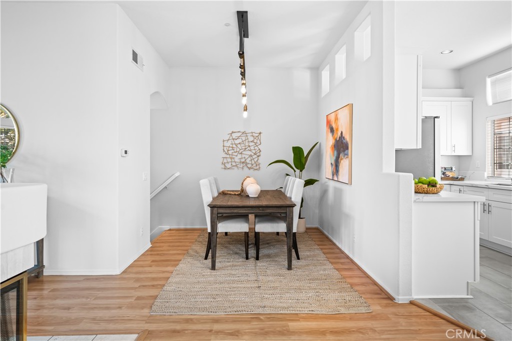 6 Arese Aisle Irvine, CA 92606 - Photo 10 of 38 a living room with furniture a rug and a table