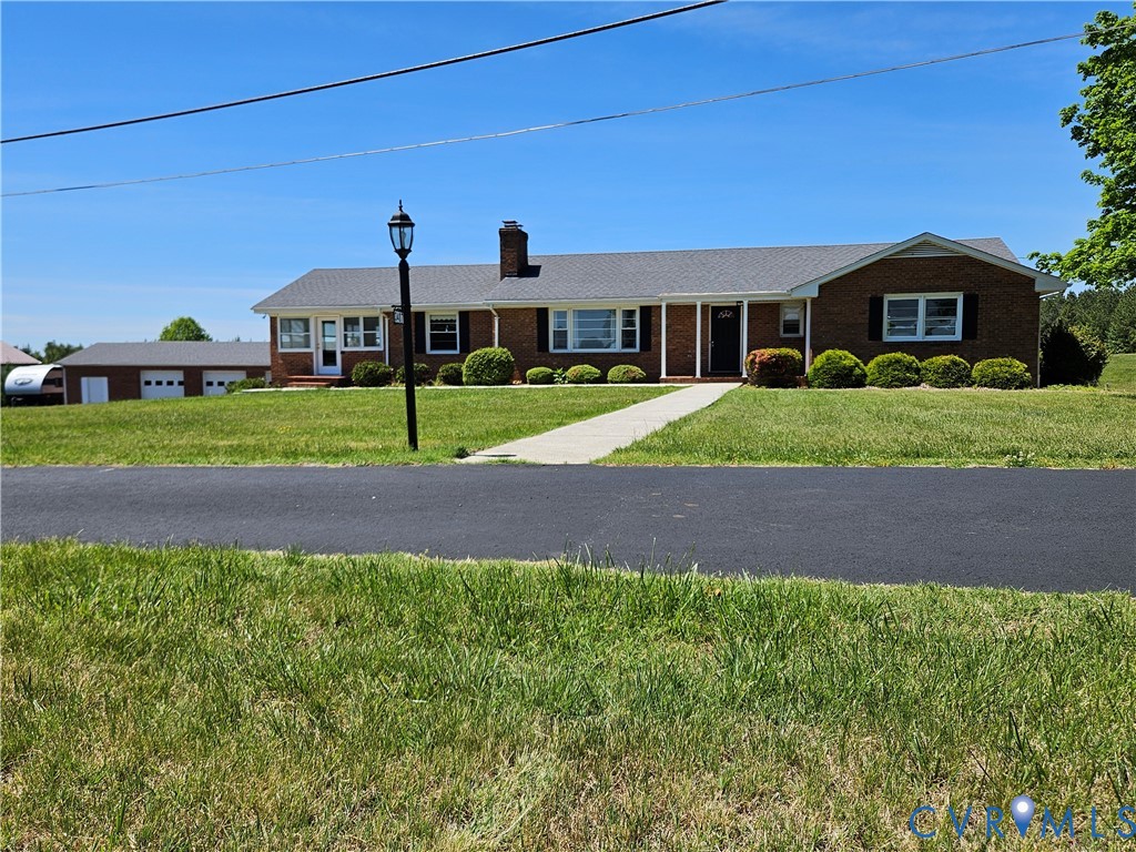 3407 Red House Road Rustburg, VA 24588 - Photo 6 of 43 Brick ranch home featuring a paved driveway, matur