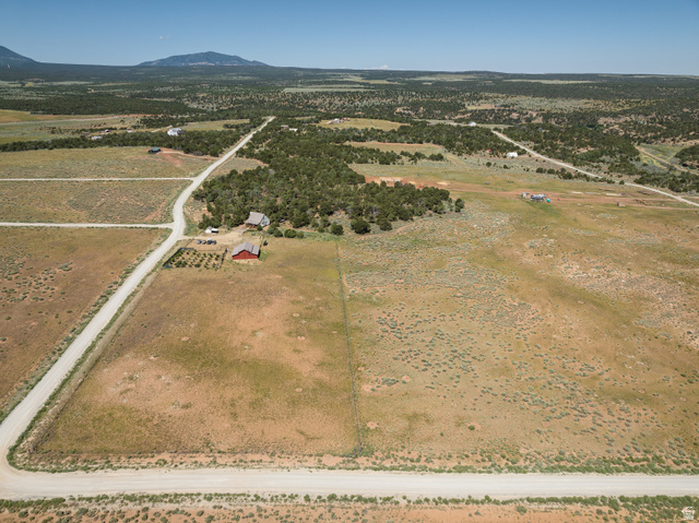 684 Blue Mountain Ridge Monticello, UT 84535 - Photo 67 of 71 Aerial overview of property's location featuring rural landscape and a mountainous background