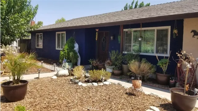 a view of a backyard of the house