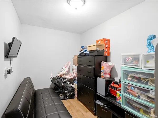 a bedroom with furniture and a book shelf
