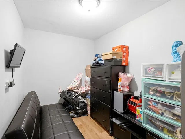 a bedroom with furniture and a book shelf
