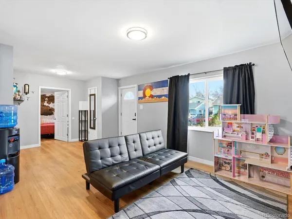 a living room with furniture and a window
