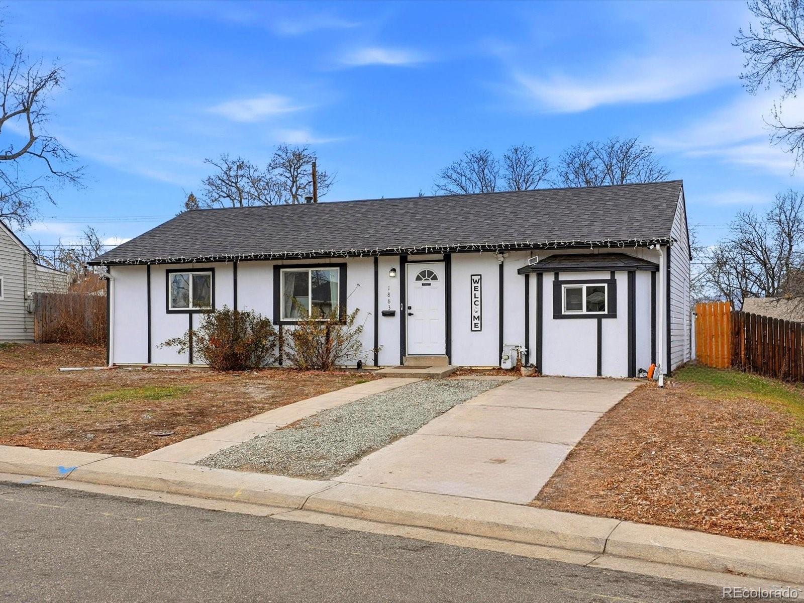 1883 South Perry Way Denver, CO 80219 - Photo 2 of 36 front view of a house with a outdoor space