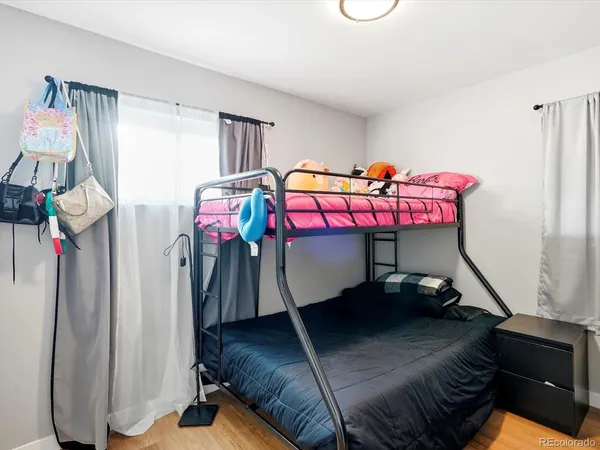 a bedroom with a bed and a table
