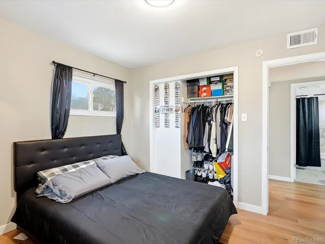 a bedroom with a bed and a closet