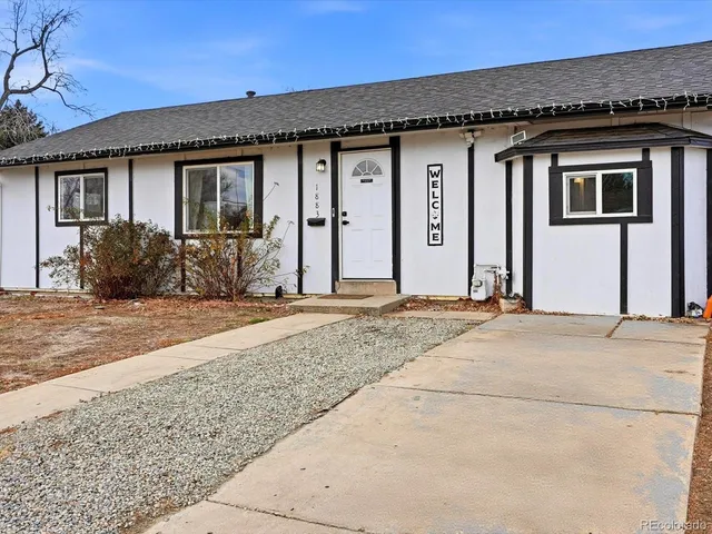 a front view of a house with a patio