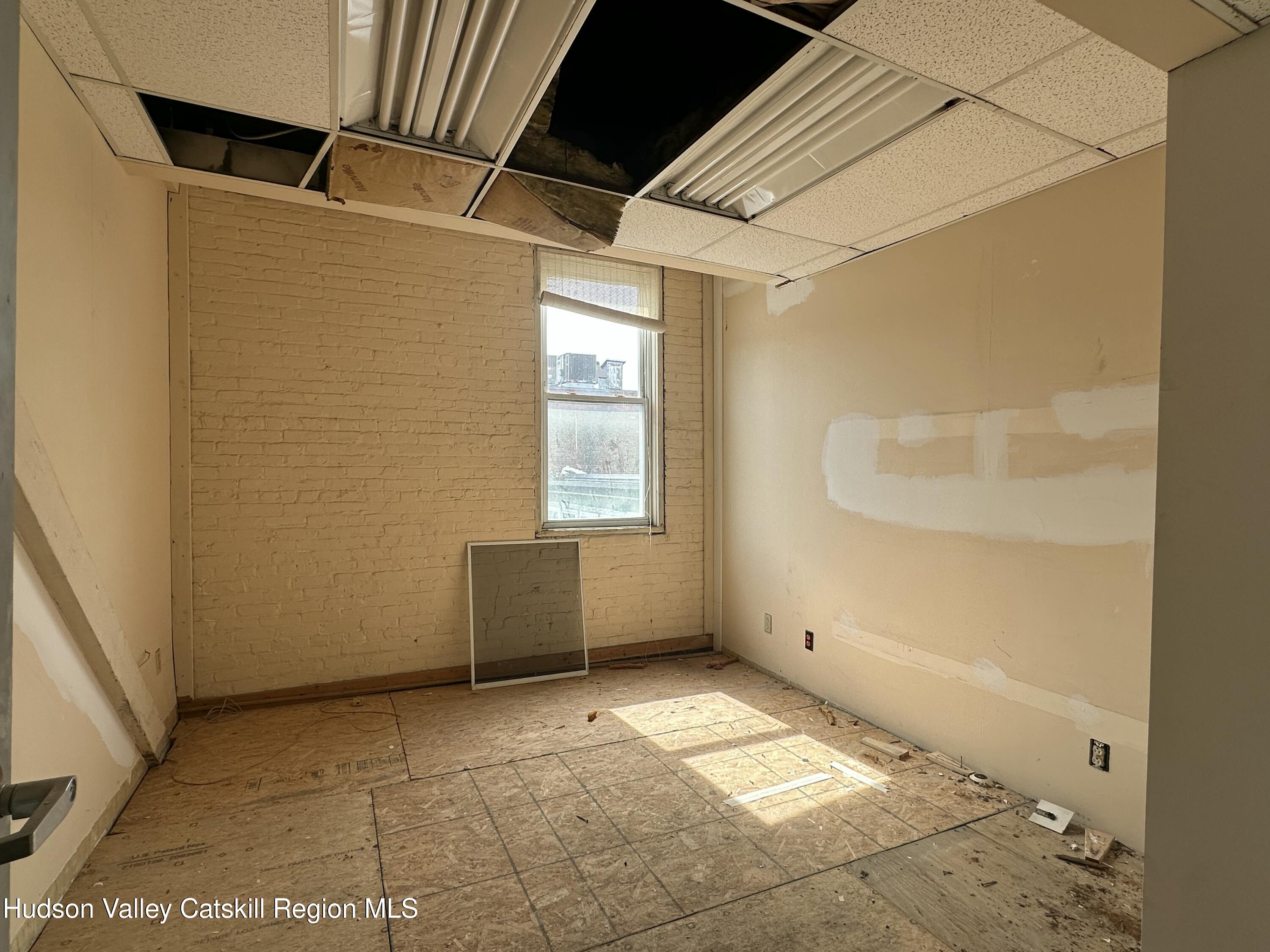 447 Main Street, Unit 477 Catskill, NY 12414 - Photo 21 of 34 a view of an empty room with a window