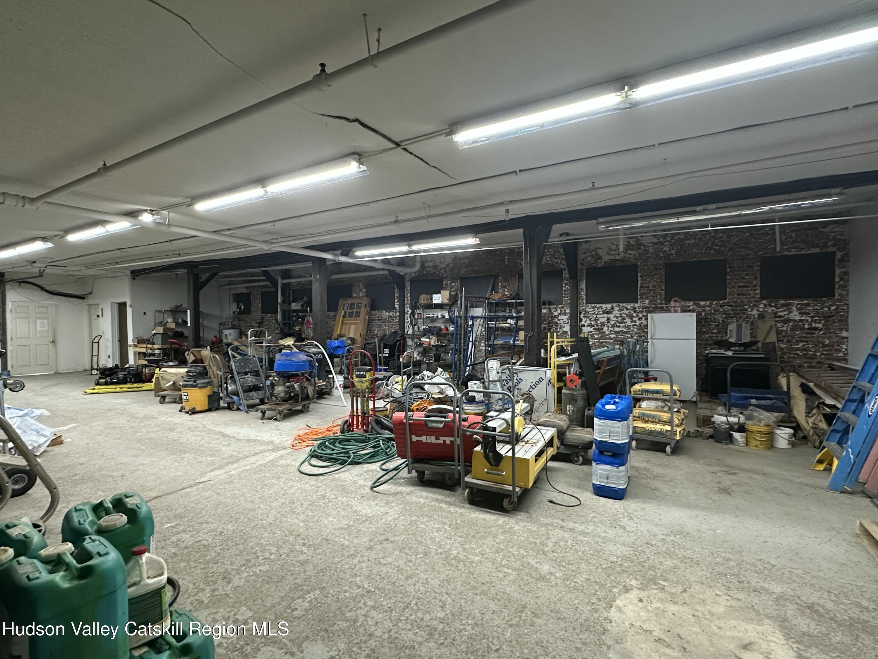 447 Main Street, Unit 477 Catskill, NY 12414 - Photo 34 of 34 a view of a storage room with furniture and a garage