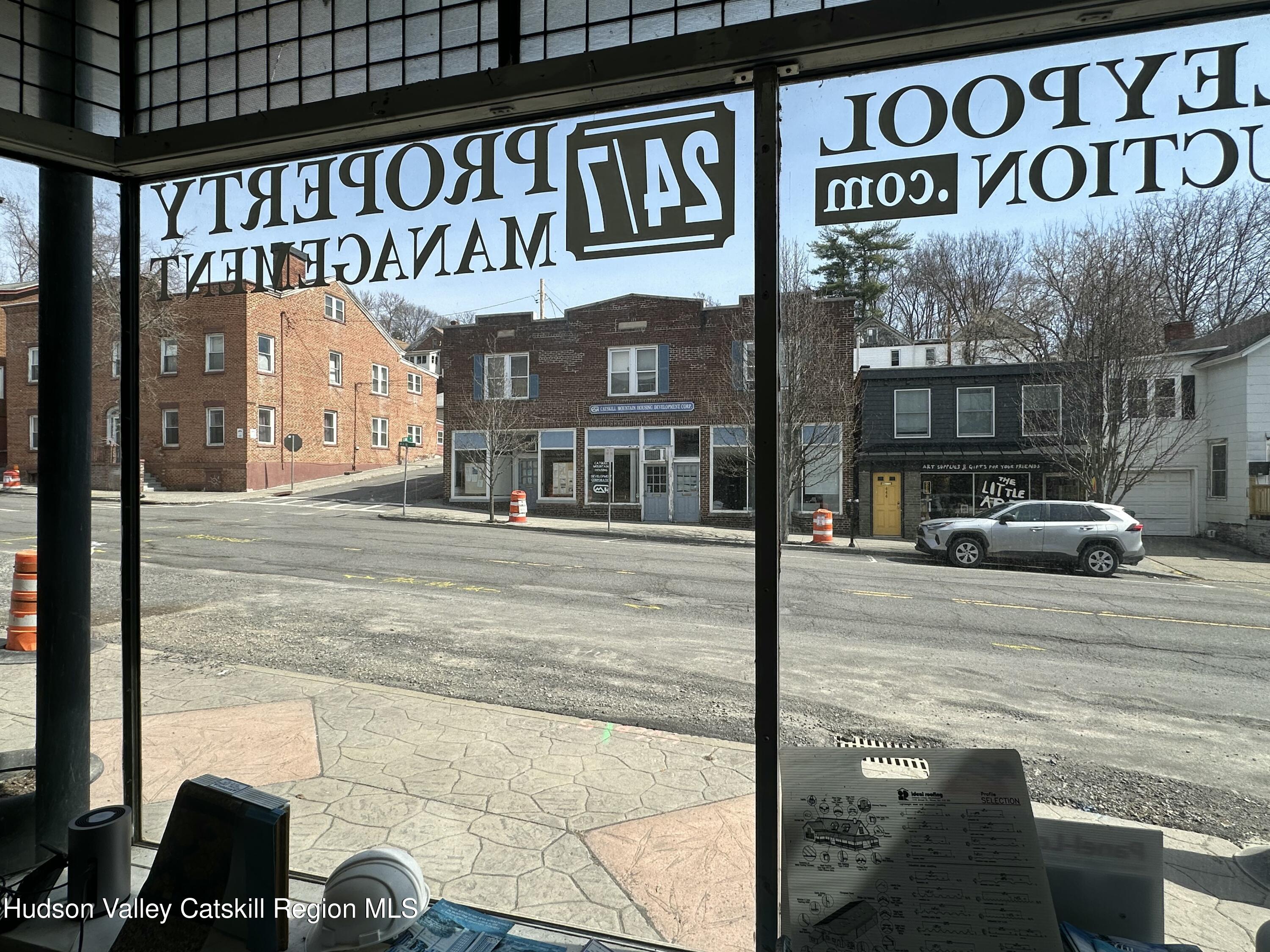 447 Main Street, Unit 477 Catskill, NY 12414 - Photo 5 of 34 a street sign on a pole on a street