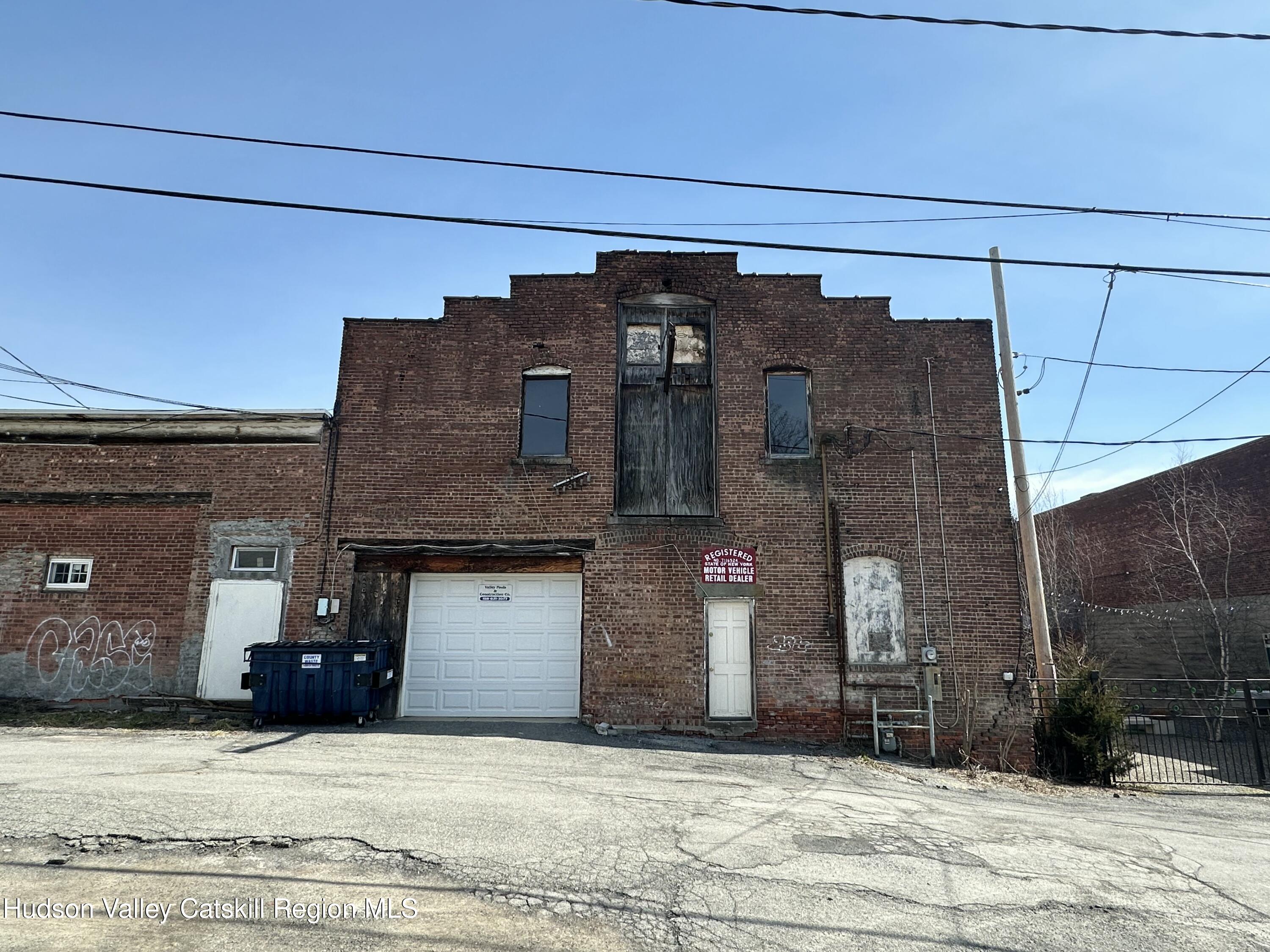 447 Main Street, Unit 477 Catskill, NY 12414 - Photo 6 of 34 a view of a brick house with a large building