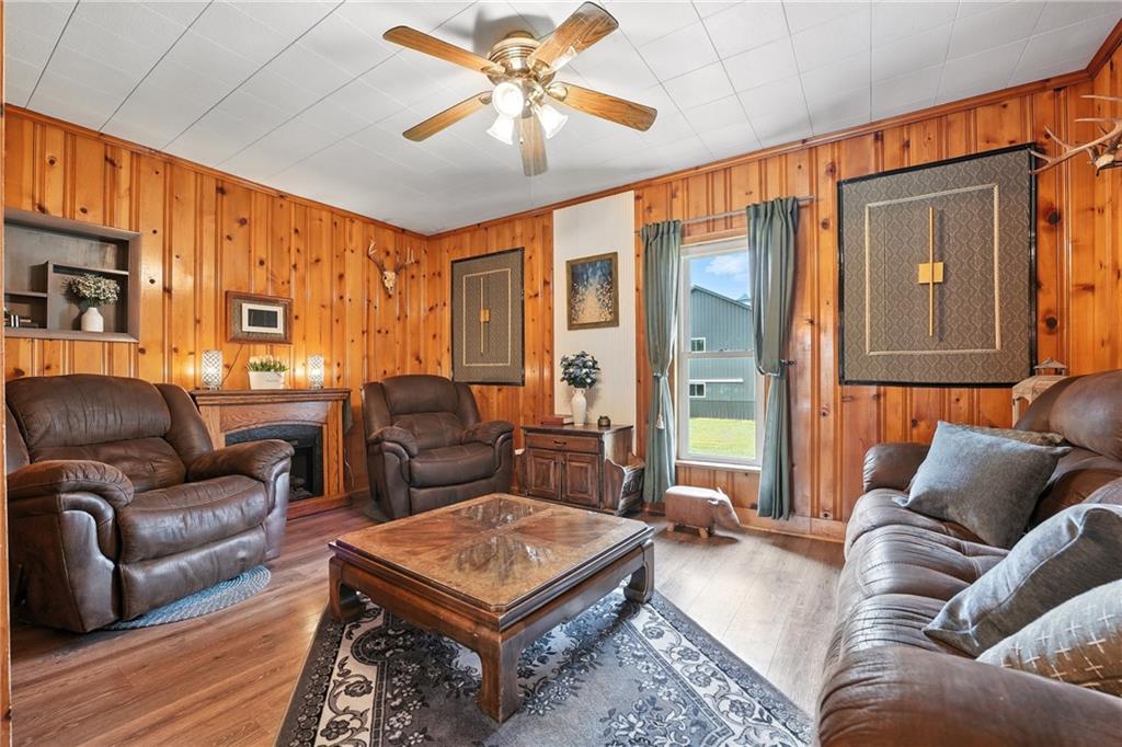 246 Lyons Road Stoneboro, PA 16153 - Photo 11 of 40 a living room with furniture a ceiling fan and a rug